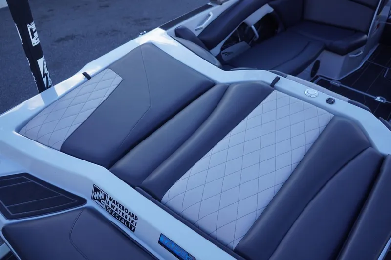 Slide: The Image of 2019 Tigé R20 boat interior with diamond-stitched upholstery and wakeboard specialty features. - 13