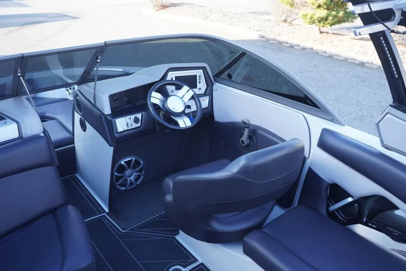Slide: The Image of 2019 Tigé R20 boat interior with sleek steering wheel and modern dashboard design. - 18