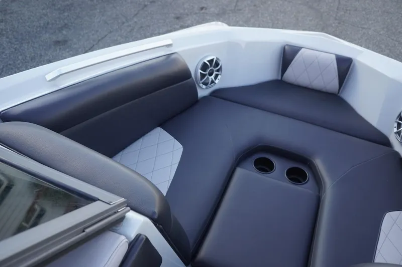 Slide: The Image of 2019 Tigé R20 boat interior with cushioned seating and cup holders. - 19
