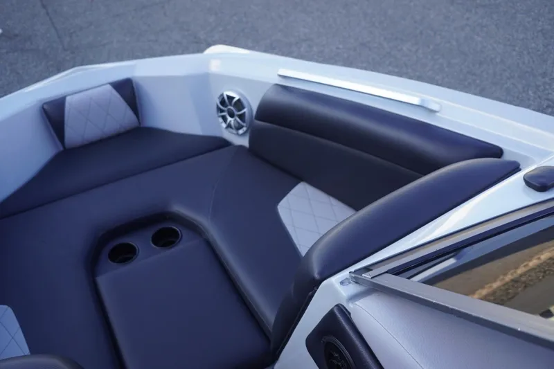 Slide: The Image of 2019 Tigé R20 boat interior with cushioned seating and cup holders. - 20
