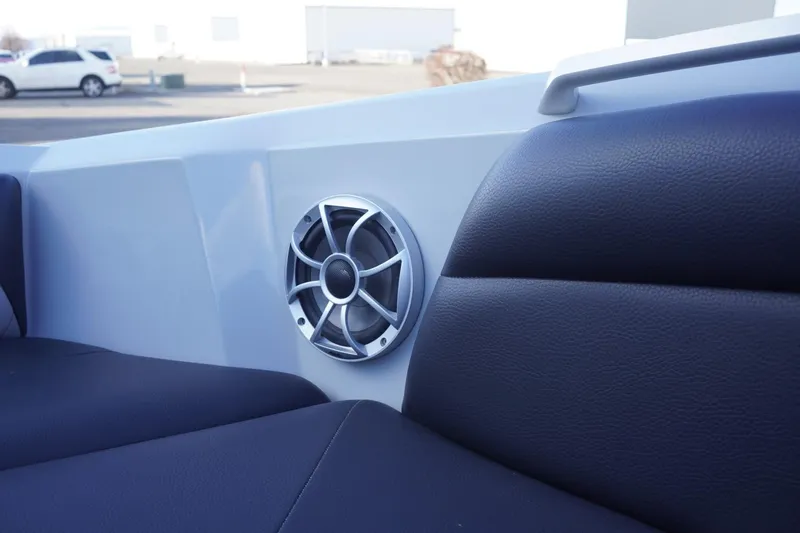 Slide: The Image of 2019 Tigé R20 boat interior with speaker and black seating. - 22
