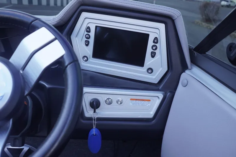 Slide: The Image of 2019 Tigé R20 boat dashboard with steering wheel and control panel. - 28
