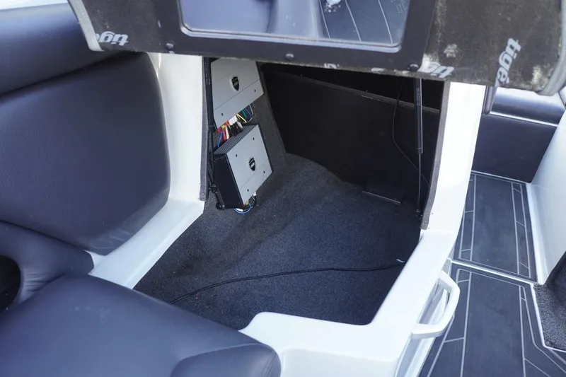 Slide: The Image of 2019 Tigé R20 boat interior showing storage compartment and wiring. - 33