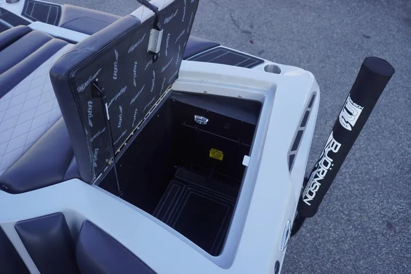 Slide: The Image of 2019 Tigé R20 boat storage compartment with open lid, showcasing interior space. - 36