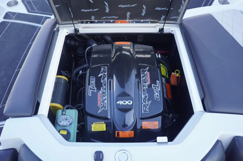 Slide: The Image of 2019 Tigé R20 boat engine compartment featuring a Raptor 6.2L motor. - 37