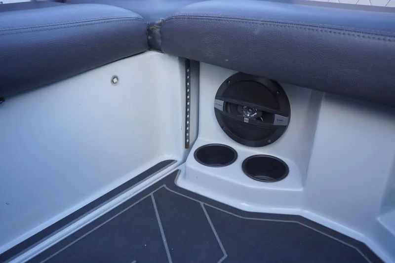 Slide: The Image of 2019 Tigé R20 boat interior with speaker and cup holders. - 43