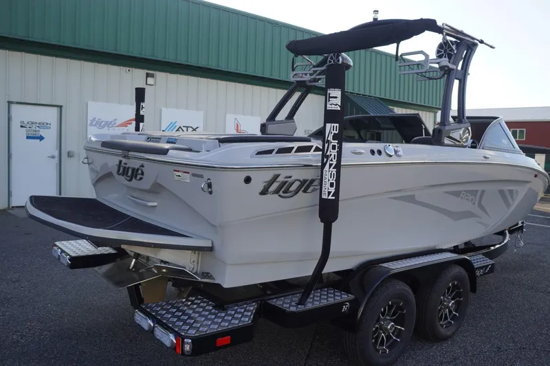 Slide: The Image of 2019 Tigé R20 boat on trailer, parked outside a building. - 47