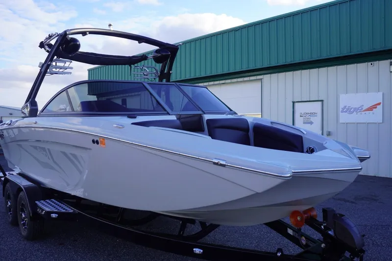 Slide: The Image of 2019 Tigé R20 boat on trailer outside a dealership. - 7