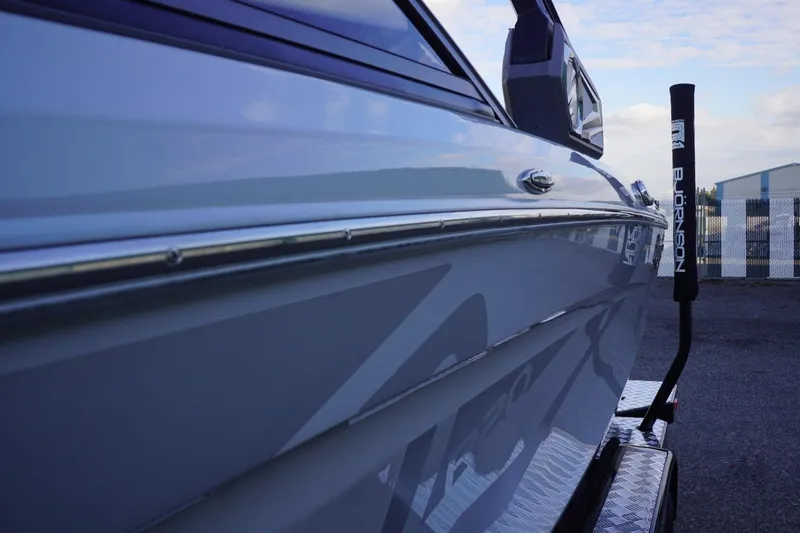 Slide: The Image of 2019 Tigé R20 boat side view with sleek design and metallic finish. - 9