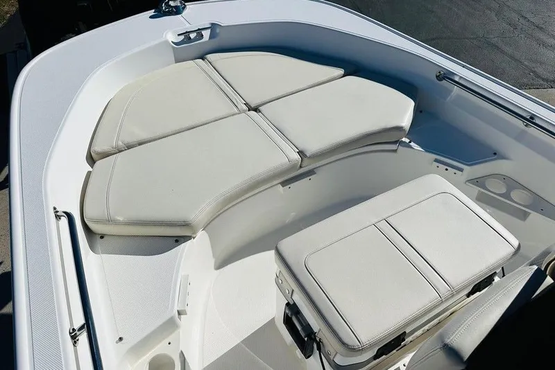 Slide: The Image of 2023 Boston Whaler 170 Montauk boat interior with cushioned seating and storage. - 3