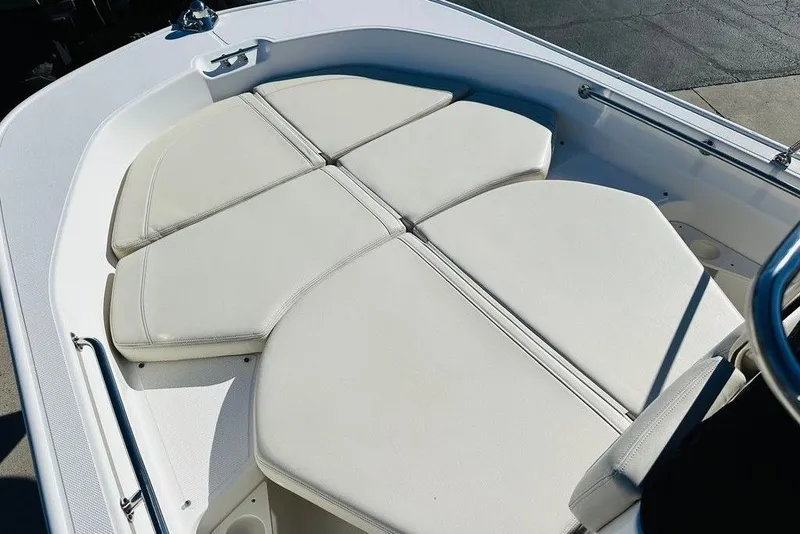 Slide: The Image of 2023 Boston Whaler 170 Montauk boat with cushioned seating area. - 8