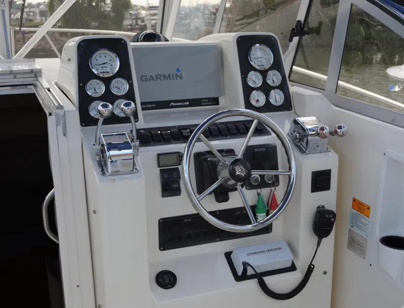Slide: The Image of Control panel of a 2001 Shamrock 290 Walkaround boat with Garmin navigation system. - 15