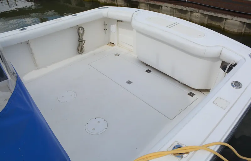 Slide: The Image of 2001 Shamrock 290 Walkaround boat deck with storage and seating. - 9