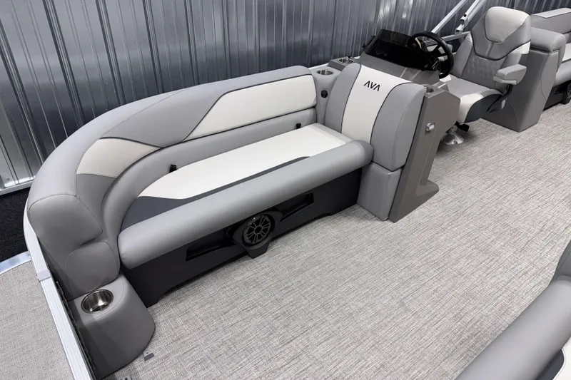 Slide: The Image of 2026 Avalon Venture 2385 QL Tritoon interior with plush seating and modern helm. - 10