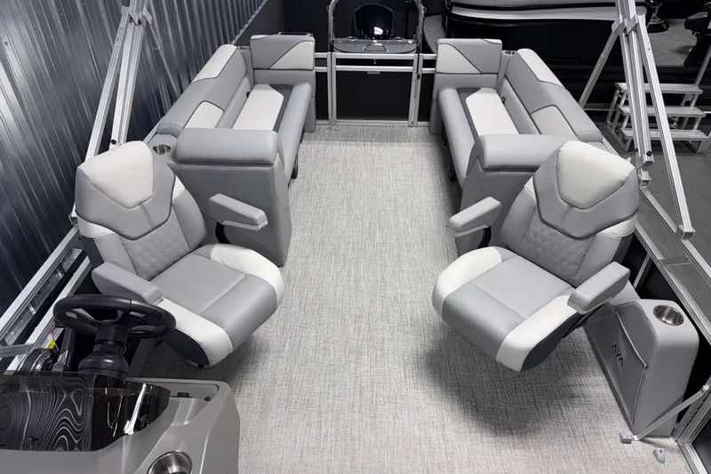 Slide: The Image of 2026 Avalon Venture 2385 QL Tritoon interior with luxurious seating and modern design. - 13