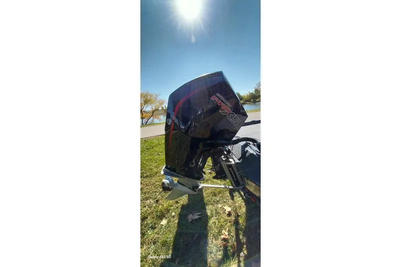 Slide: The Image of Outboard motor on a 2025 Ranger ALPHA 208 boat under bright sunlight. - 11