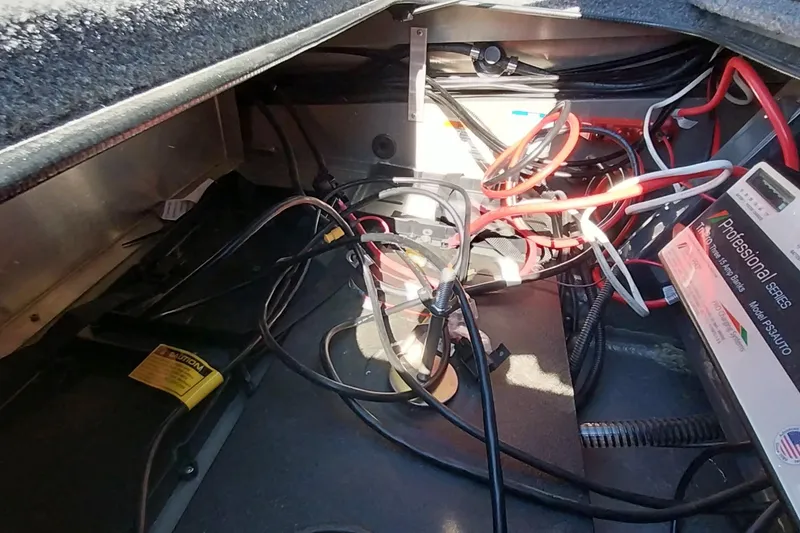 Slide: The Image of Tangled wires and battery setup inside Ranger ALPHA 208, 2025 model. - 13