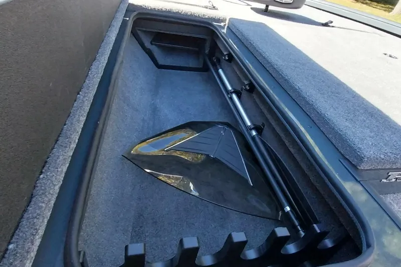 Slide: The Image of Storage compartment of 2025 Ranger ALPHA 208 boat, featuring organized interior space. - 14