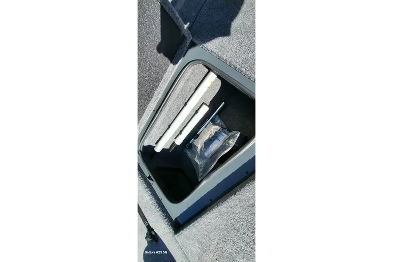 Slide: The Image of Storage compartment of 2025 Ranger ALPHA 208 boat with accessories. - 16