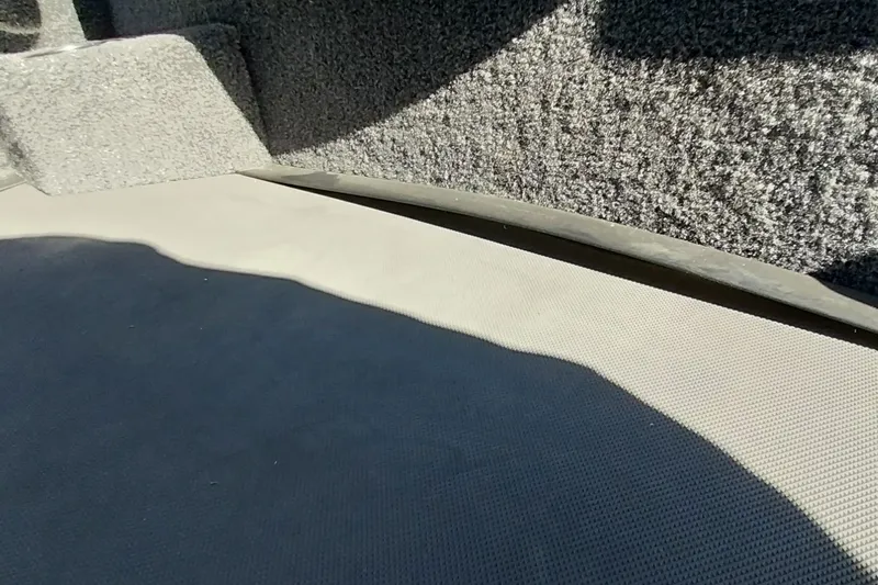 Slide: The Image of Interior view of 2025 Ranger ALPHA 208 boat with textured flooring. - 17