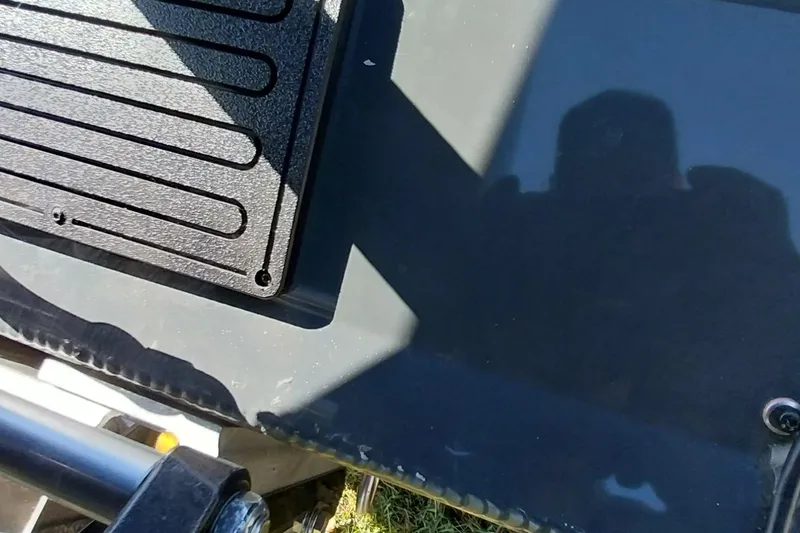 Slide: The Image of Close-up of Ranger ALPHA 208 (2025) vehicle part with textured surface and shadow. - 19