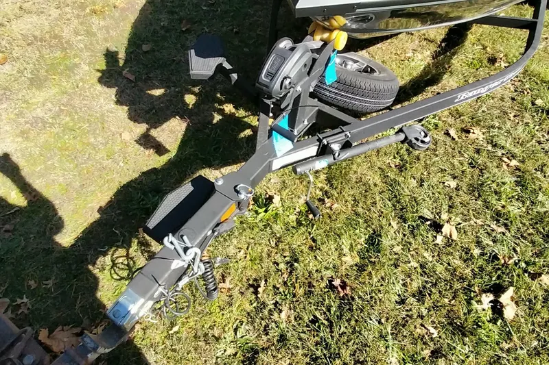 Slide: The Image of Trailer hitch of 2025 Ranger ALPHA 208 on grass, showing detailed components. - 22