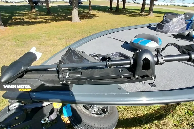 Slide: The Image of Ranger ALPHA 208 boat with Minn Kota Maxxum trolling motor, 2025 model, on grassy area. - 26