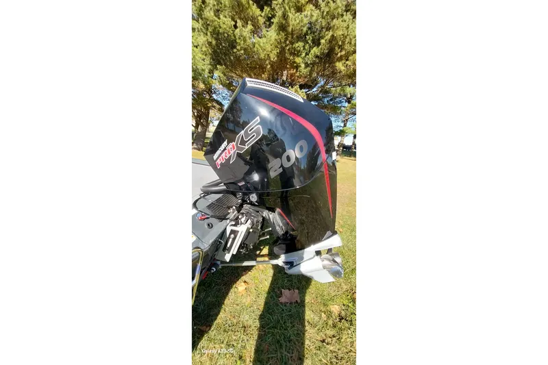 Slide: The Image of Outboard motor on a 2025 Ranger ALPHA 208 boat, parked on grass. - 9