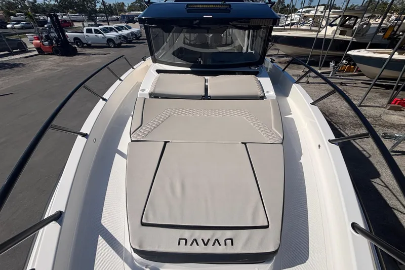 Slide: The Image of 2026 Navan C30 boat with cushioned deck, docked in marina. - 15