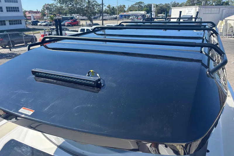 Slide: The Image of Roof of 2026 Navan C30 with roof rack and light bar in a parking lot. - 16