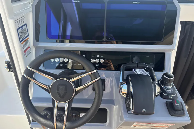 Slide: The Image of Steering console of 2026 Navan C30 boat with advanced controls and dual screens. - 24