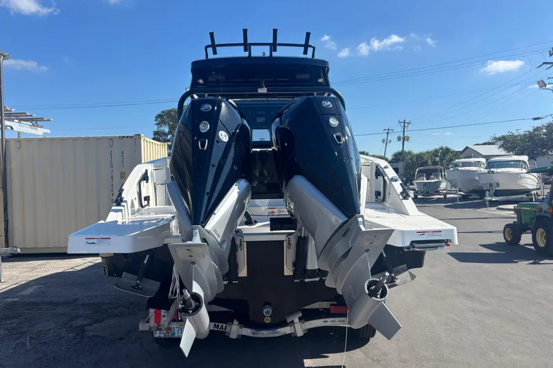 Slide: The Image of Rear view of 2026 Navan C30 boat with dual outboard motors in a marina setting. - 6