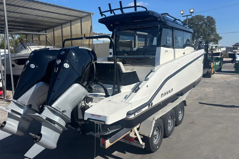 Slide: The Image of 2026 Navan C30 boat with dual outboard engines on a trailer. - 8
