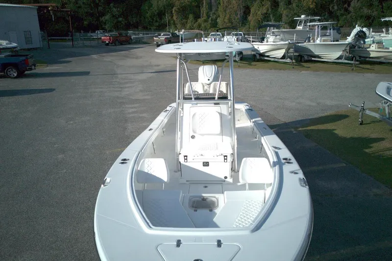 Slide: The Image of 2026 BlackJack 256 Coastal boat in a marina, showcasing sleek design and spacious deck. - 15