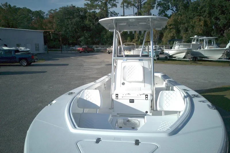 Slide: The Image of 2026 BlackJack 256 Coastal boat with sleek design in a marina setting. - 6