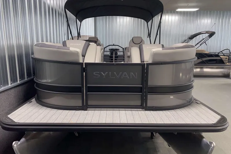 Slide: The Image of 2025 Sylvan L3 LZ pontoon boat with sleek design in showroom setting. - 14