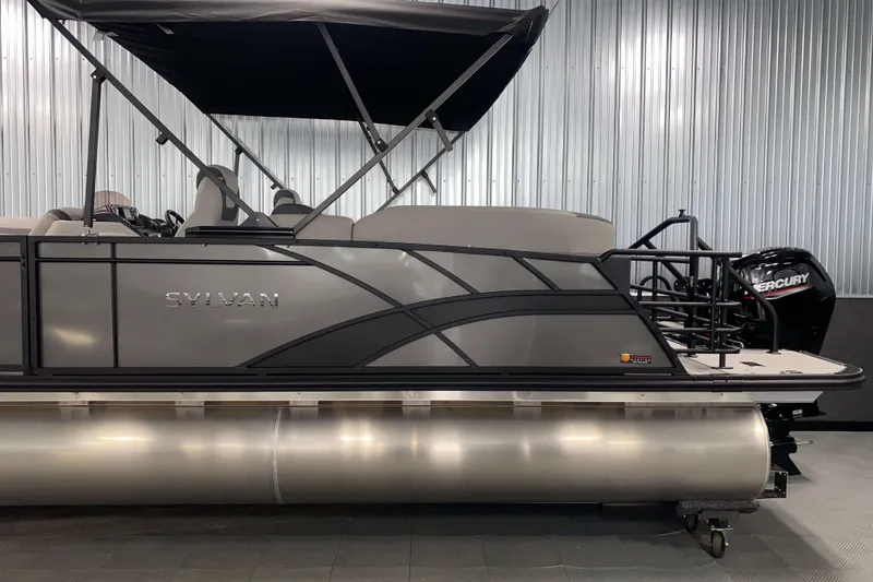 Slide: The Image of 2025 Sylvan L3 LZ pontoon boat with Mercury outboard motor in a showroom. - 17