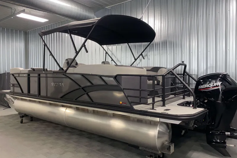 Slide: The Image of 2025 Sylvan L3 LZ pontoon boat with Mercury engine in a showroom. - 18