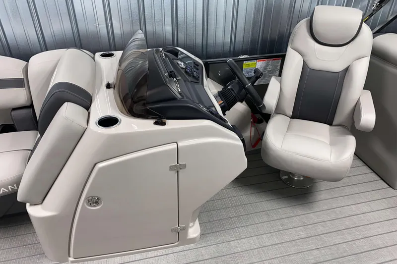 Slide: The Image of 2025 Sylvan L3 LZ boat interior with modern helm and comfortable seating. - 5