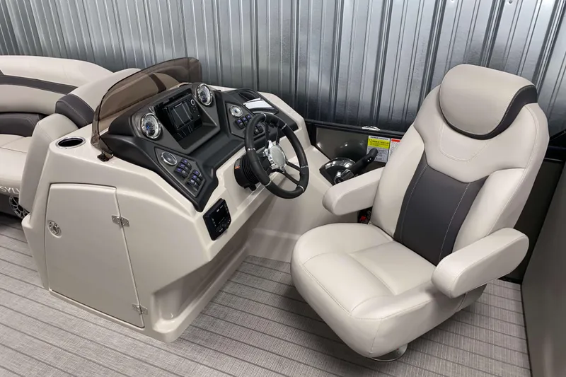 Slide: The Image of 2025 Sylvan L3 LZ boat interior with modern helm and comfortable captain's chair. - 7