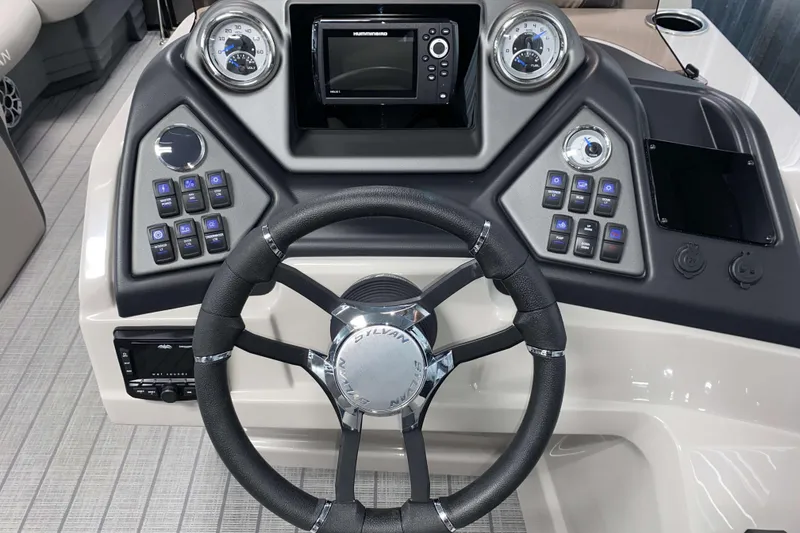Slide: The Image of 2025 Sylvan L3 LZ boat dashboard with steering wheel and control panel. - 8