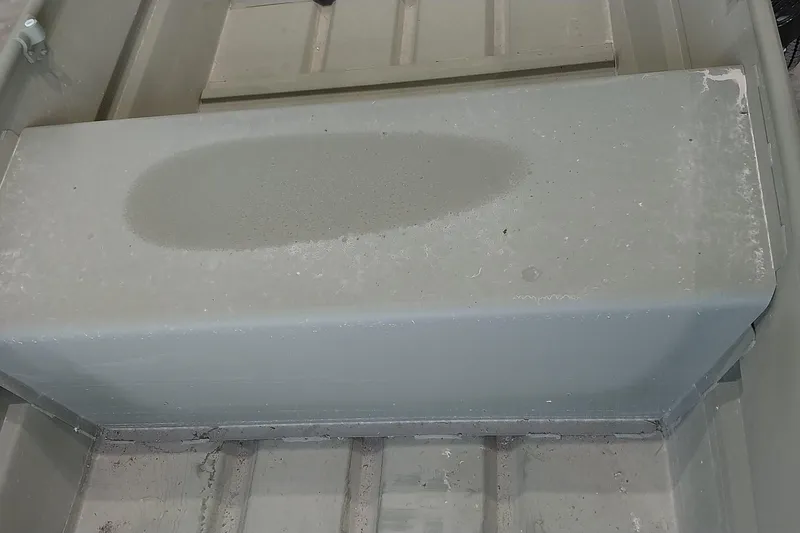 Slide: The Image of 2025 Tracker Grizzly 1436 Utility boat interior with visible wear and dirt. - 10