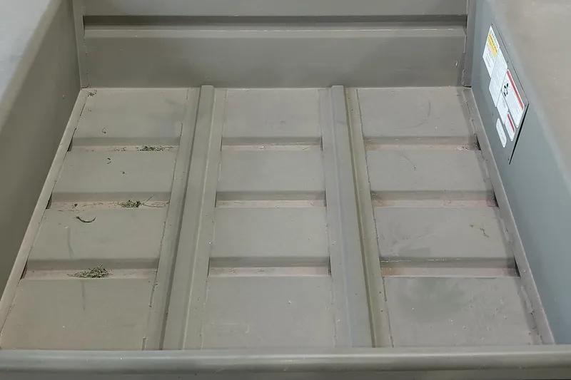 Slide: The Image of Interior view of 2025 Tracker Grizzly 1436 Utility boat, showcasing durable flooring. - 11