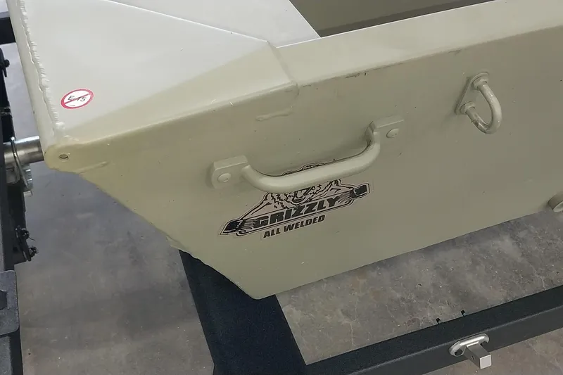 Slide: The Image of 2025 Tracker Grizzly 1436 Utility boat, all-welded design, shown on a trailer. - 14