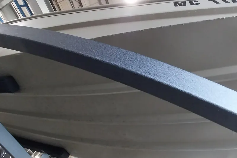 Slide: The Image of 2025 Tracker Grizzly 1436 Utility boat detail in a storage facility. - 16