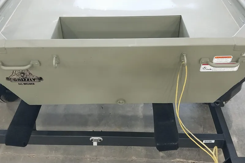 Slide: The Image of 2025 Tracker Grizzly 1436 Utility boat on trailer, featuring all-welded construction. - 19