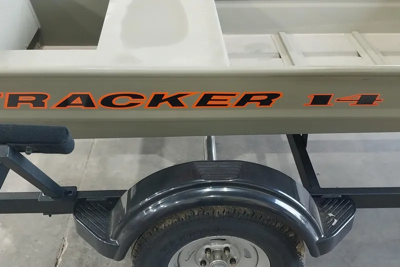 Slide: The Image of 2025 Tracker Grizzly 1436 Utility boat on trailer, featuring bold orange lettering. - 20