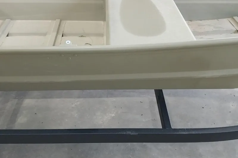 Slide: The Image of 2025 Tracker Grizzly 1436 Utility boat on display in a showroom. - 21