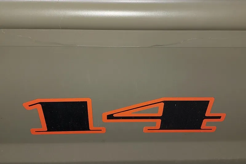 Slide: The Image of Tracker Grizzly 1436 Utility 2025 model with bold '14' decal on side. - 22