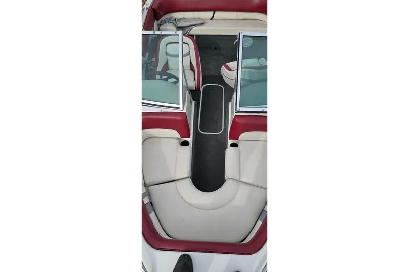 Slide: The Image of 1992 Starcraft Elite 171 boat interior with red and white seating and open windshield. - 3